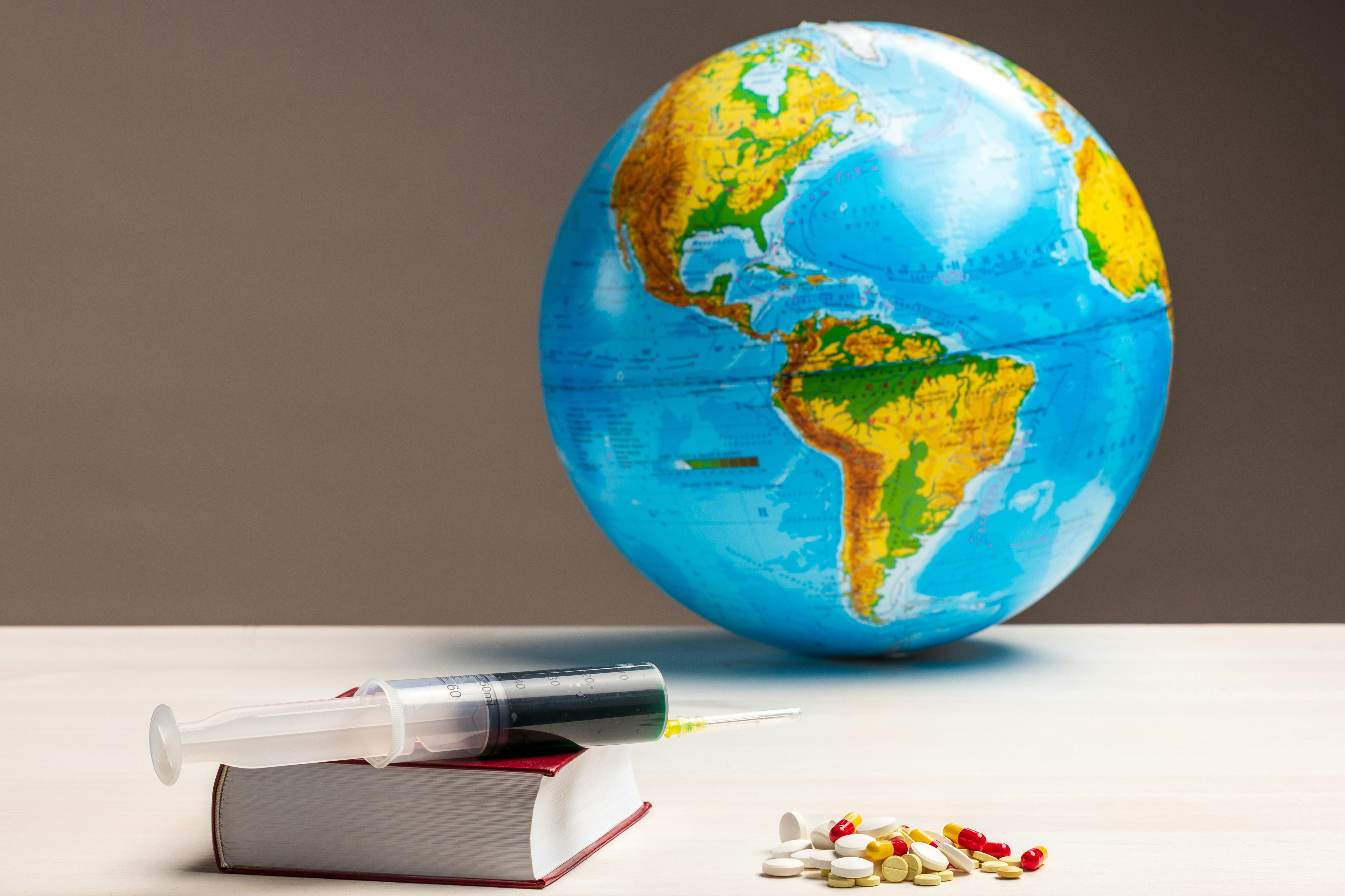 Globe with medical supplies representing medical tourism